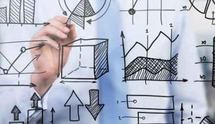 Quantitative analyst is drawing different charts on a glass screen. Photo by: ImageFlow. Source: shutterstock.com